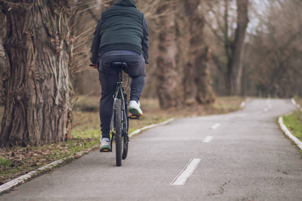 istock Man riding his bicycle out in nature 1132934099