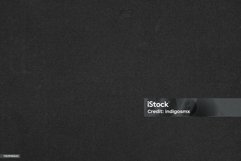 Black polyester synthetic cloth textured background Close-up black polyester synthetic cloth textured, fabric surface abstract background Textured Stock Photo