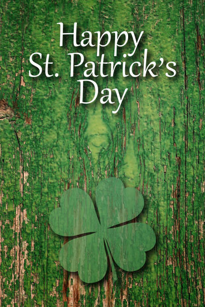 istock Happy st. patrick's day, text and clover leaf over old green wooden wall 1132936592