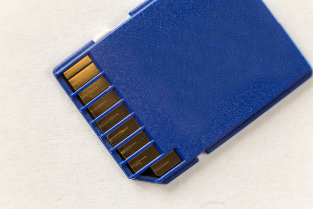istock Close-up of blue micro SD memory card isolated on white copy space background. Modern electronic technology, information saving concept. 1132939643