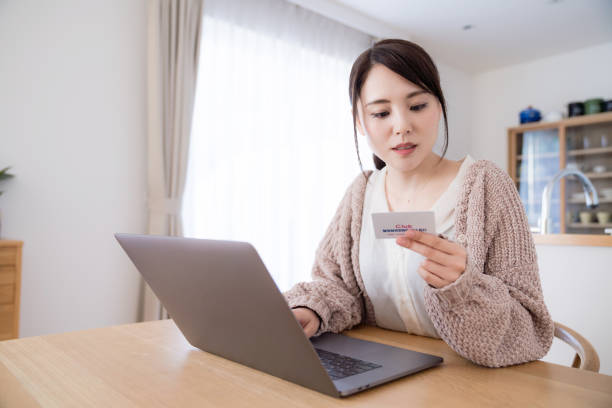 istock Young woman using credit card. 1132939687