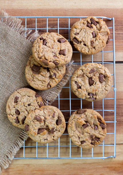istock Chocolate chip cookies on the sieve on wood table. 1132941333