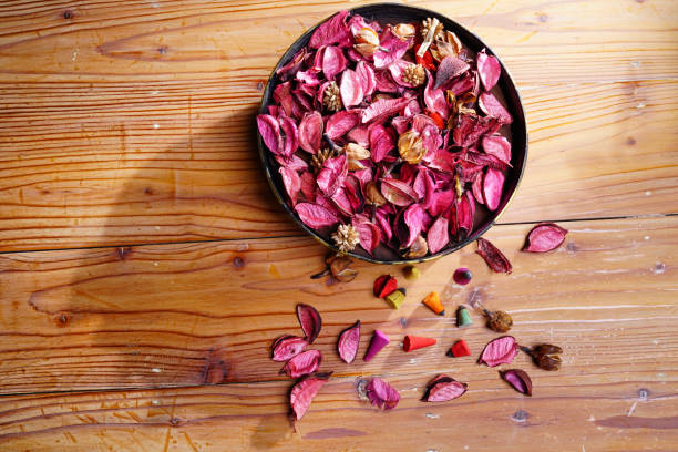 istock Dried flower petals on wood table 1132941631
