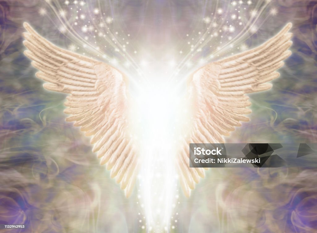 Angelic Light Being Pair of Angel Wings with bright white light between and a stream of glittering sparkles flowing upwards against an ethereal gaseous energy formation background Angel Stock Photo