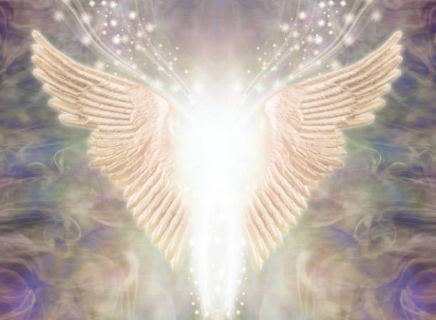 Angelic Light Being Pair of Angel Wings with bright white light between and a stream of glittering sparkles flowing upwards against an ethereal gaseous energy formation background reiki photos stock pictures, royalty-free photos & images