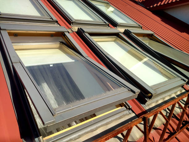 istock Red tiled house roof with attic windows. Roofing construction, window installation, modern architecture concept. 1132943210