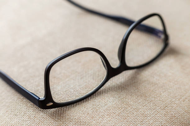 istock Reading spectacles, fashionable eyeglasses isolated on blurred white copy space background. 1132943219