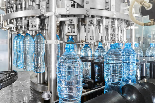 istock Modern automated mineral water bottling line 1132945027