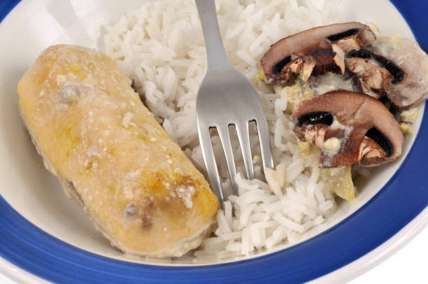 quenelle-based meal with rice and cut mushrooms