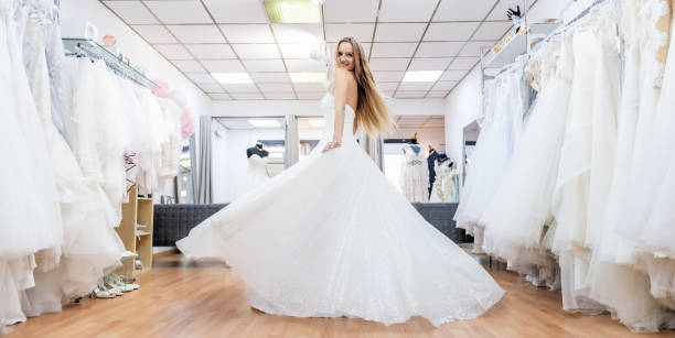 istock Young bride dancing in bridal shop 1132945814