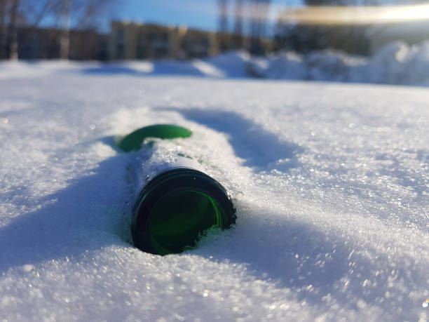 istock beautiful bottle in the snow in winter 1132946946