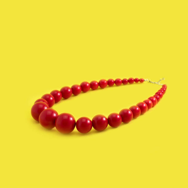 istock Jewelry women's beads red on a yellow background. 1132947618