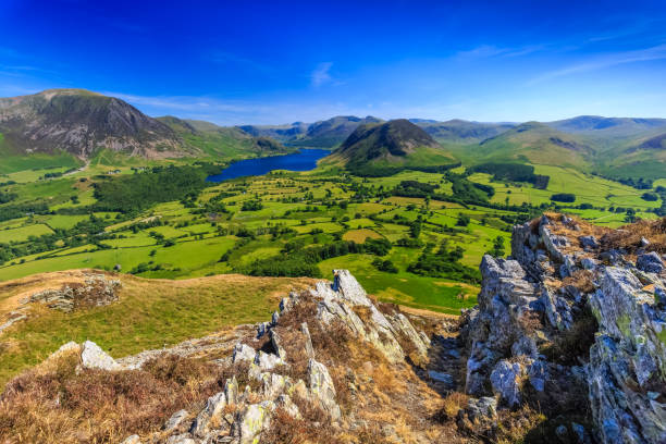 Crummock water valley from Low fell Crummock water valley from Low fell in The Lake District, Cumbria, England derwent water stock pictures, royalty-free photos & images