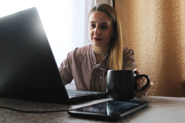 istock Morning coffee and work on laptop at home 1132950116
