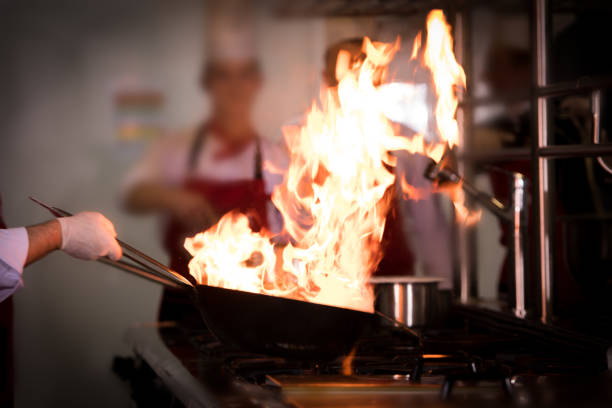 istock Chefs cooking in commercial kitchen 1132950537