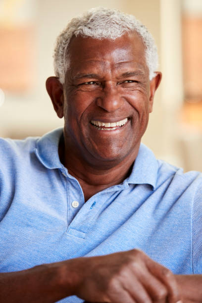 istock Smiling Senior Man Relaxing On Sofa At Home 1132950596