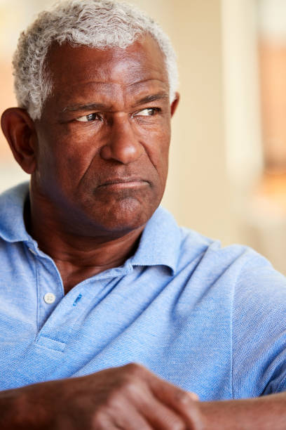 istock Thoughtful Senior Man Sitting On Sofa At Home 1132950658