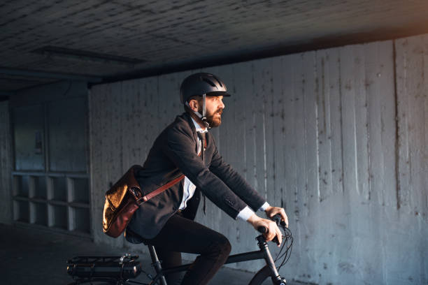 hipster businessman commuter with electric bicycle traveling to work in city. - cycling bicycle hipster urban scene imagens e fotografias de stock