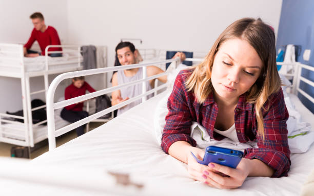 istock Girl ignoring neighbors in hostel 1132956329