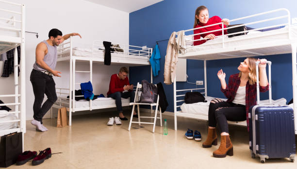 istock Travelers communicating in hostel bedroom 1132956337