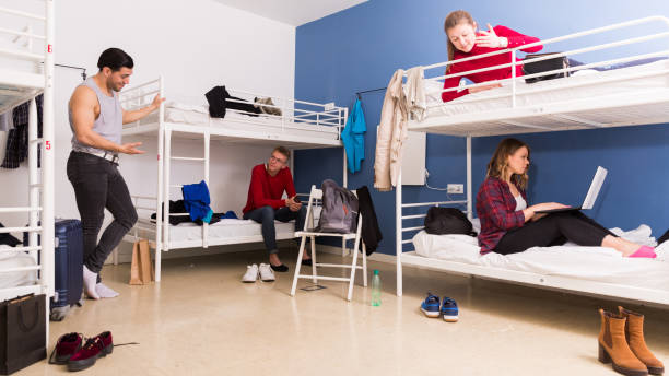 istock Travelers resting in hostel bedroom 1132956353