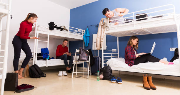 istock Travelers communicating in hostel bedroom 1132956356
