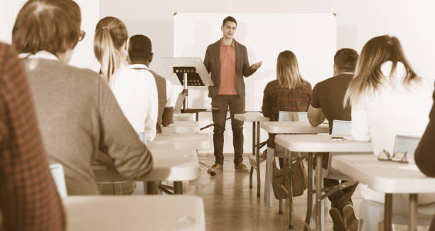 istock Male teacher giving presentation for students 1132956415