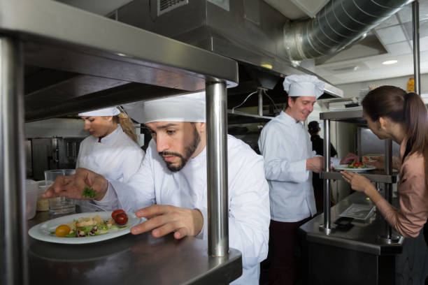 istock Staff of restaurant with head chef working 1132956469