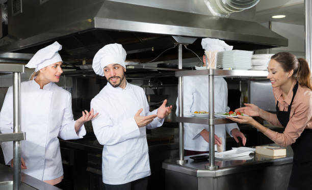 istock Staff of restaurant with adult chef in kitchen 1132956477