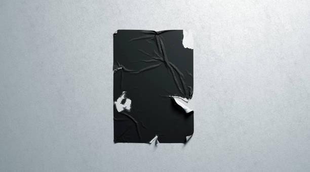 istock Blank black wheatpaste adhesive torn poster mockup white textured wall 1132958345