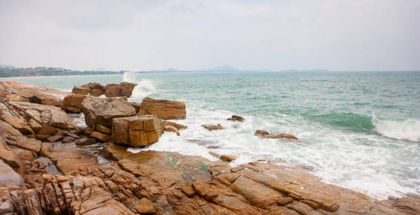 istock Waves crashing on rocks at coast 1132959631
