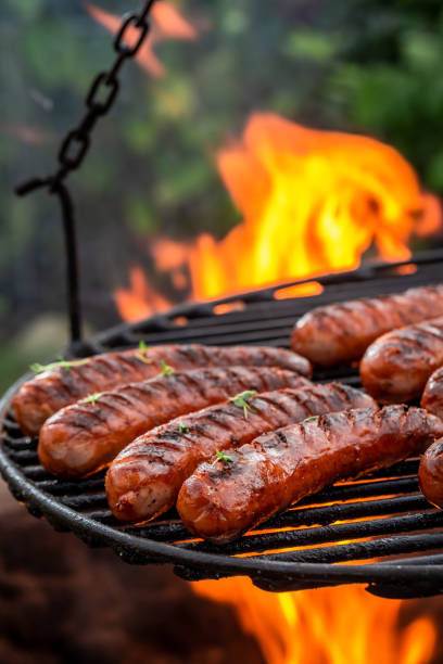 istock Hot sausage on grill with herbs and spices 1132960315
