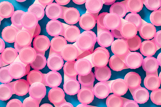 istock Pink contact lens cases on blue background 1132963735