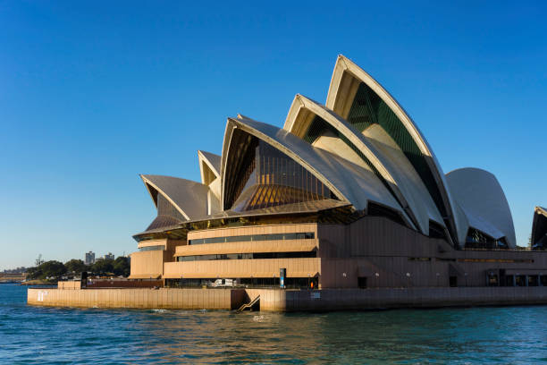 Sydney Australia - August 17, 2018: A clear day in Sydney, New South Wales, and this is the view looking across Circular Quay towards the iconic shape of the city's Opera House.