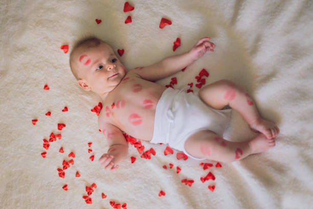 istock Cute baby boy covered with lipstick kisses 1132965905