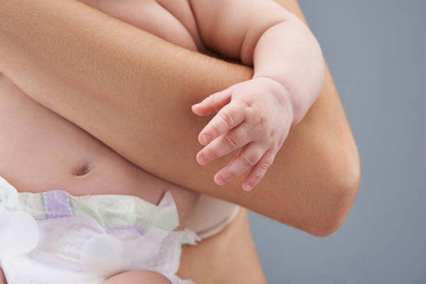 istock New born baby hands close up to camera 1132966083