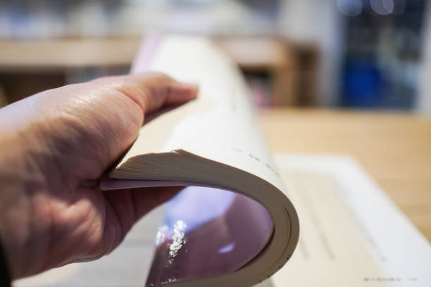 istock A man's hand with Book in the library. 1132968325
