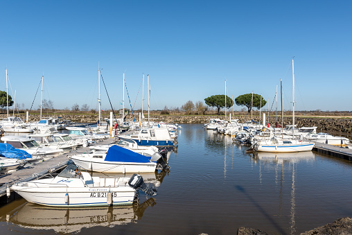 Arcachon, France - February 23, 2019 : The small marina of Le Teich (Arcachon), on the Arcachon Bay, is not on the ocean but a little behind, on the river Leyre where the boats are sheltered.