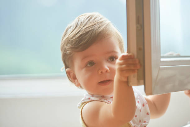 istock little girl near window 1132970869