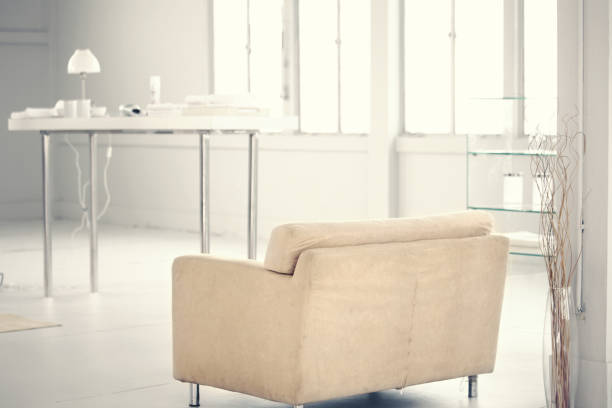 istock behind the beige sofa in white room 1132972200