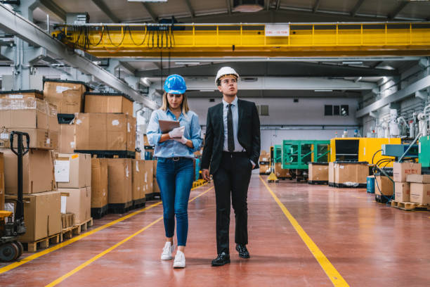 istock Business colleagues working with tablet computer in factory 1132975649