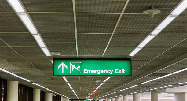 istock Emergency exit information board sign international airport terminal 1132975754