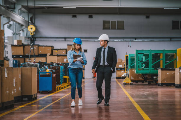 istock Business colleagues working with tablet computer in factory 1132976934