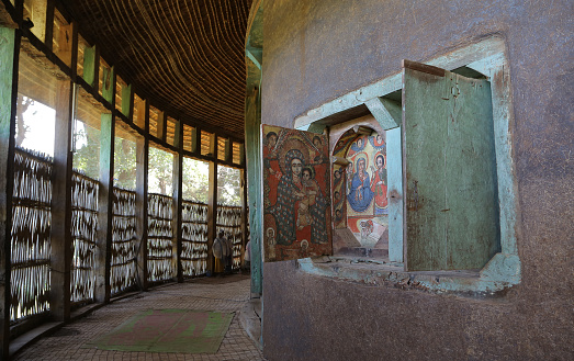 This is the Ura Kidane Mehret church of the Ethiopian Orthodox Church in the Zege peninsula around Lake Tana in Ethiopia. About the Paintings shows parts of the old and new testament.  The present circular church dates from the 16th century. Its wall are decorated with numerous murals painted between 100 and 250 years ago.