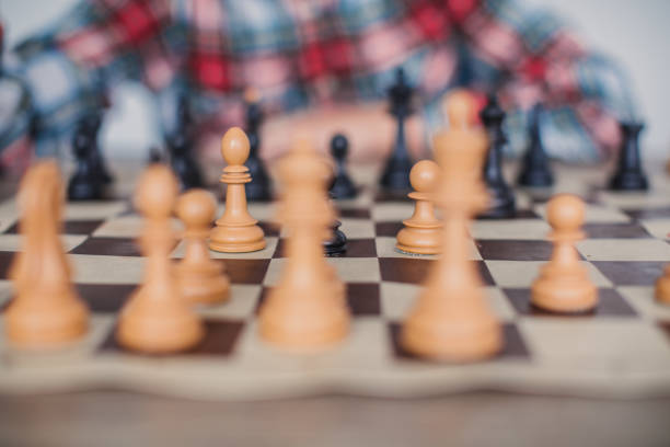 Chess board with figures in front of boy.