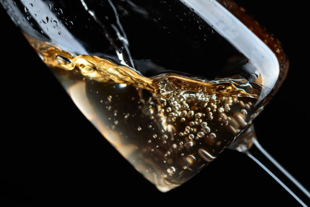 istock White wine being poured into glass. 1132984254