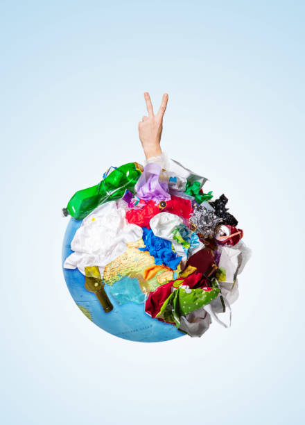 istock A globe of the earth with trash over white background, the concept of ecology problem 1132986100