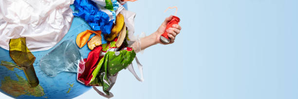 istock A globe of the earth with trash over white background, the concept of ecology problem 1132986111