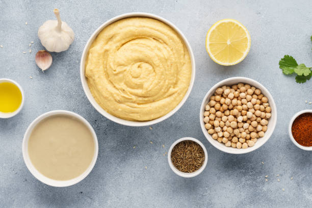 istock Hummus ingredients - chickpea, lemon, garlic, sesame, olive oil 1132986202