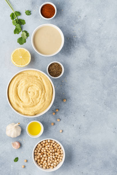 istock Hummus ingredients. Chickpea, tahini, olive oil, sesame, herbs. 1132987473